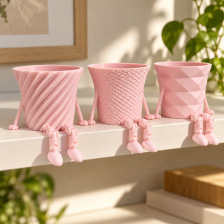 Trio de cache-pots à jambes articulées